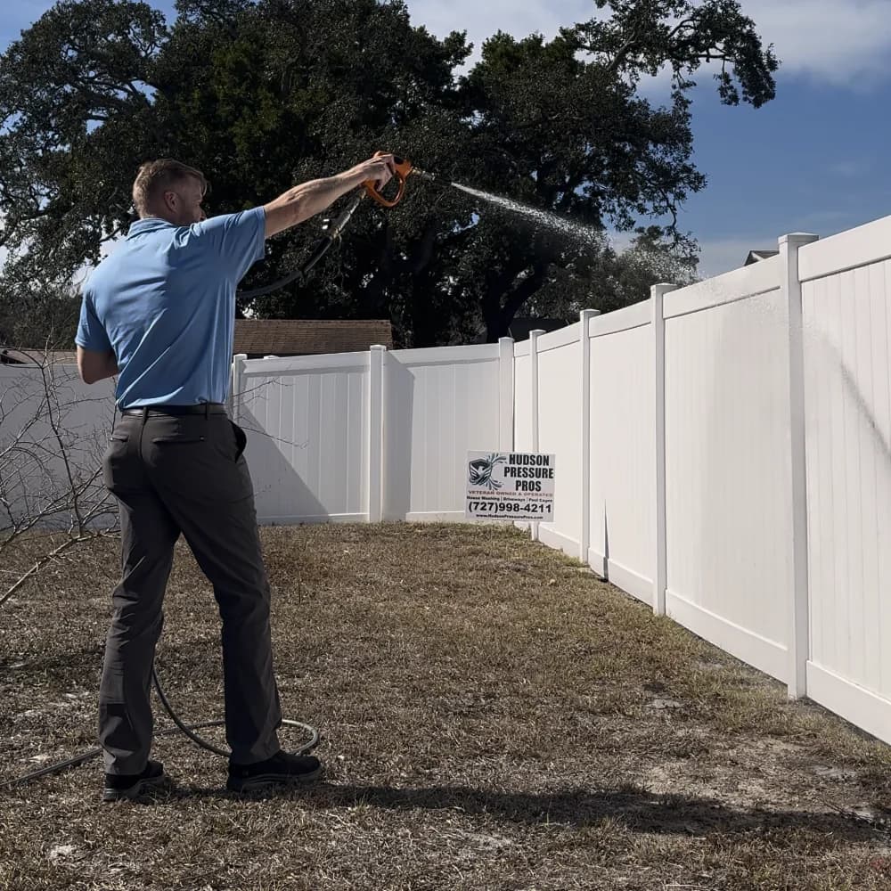Steve cleaning a fence in Hudson, FL - Hudson Pressure Pros