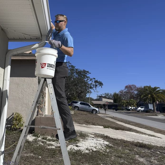 Steve cleaning gutters in Hudson, FL - Hudson Pressure Pros